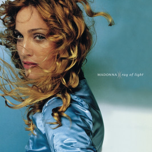 Album cover featuring Madonna with wavy hair against a blue background, with 'Madonna Ray of Light' text.