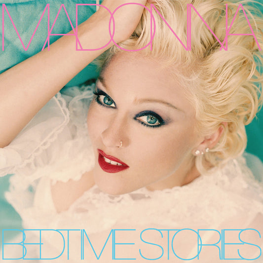 Album cover with Madonna with blonde hair and red lipstick, featuring the text 'Madonna' and 'Bedtime Stories'.