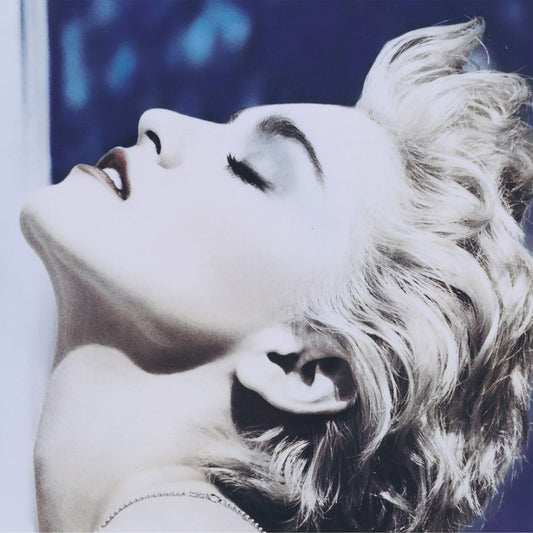 Close-up of Madonna with blonde hair and a blurred background